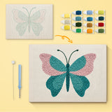 Teal Blush Butterfly canvas before and after punching, with the threads and tools