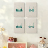 The four Teal Bralettes mini canvases on a wall above a shelf