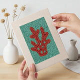 Hand holding a finished Teal Coral Reef mini canvas