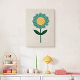 Finished Teal Daisy punch needle canvas on a wall