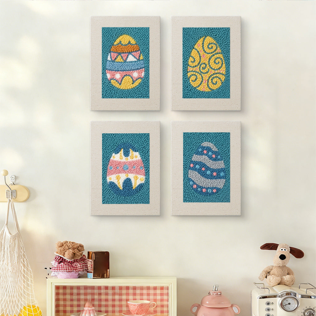 The four Teal Easter Eggs mini canvases on a wall above a shelf