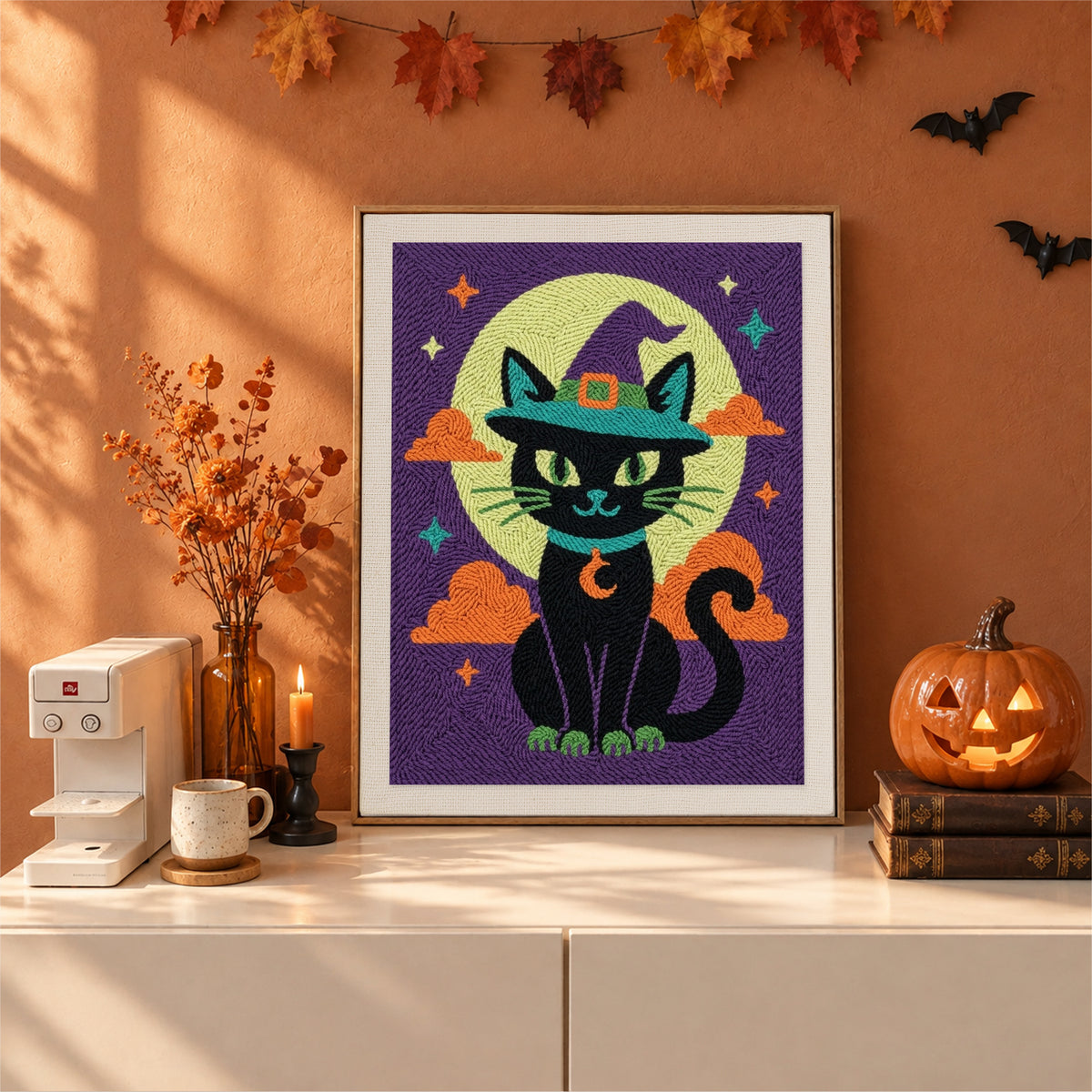 Finished Teal Hat Black Cat punch needle canvas on a wall