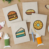The four finished Teal Layer Cake mini canvases laid out on a table