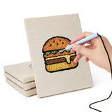 Hand punching one of the Teal Layer Cake mini canvases