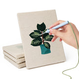 Hand punching one of the Teal Pot Greens mini canvases