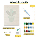 What is in the Teal Pot Leaves kit: printed canvas, punch needle, threader, threads, color guide and hangers