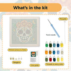 What is in the Teal Sugar Skull kit: printed canvas, punch needle, threader, threads, color guide and hangers