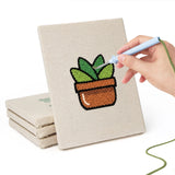 Hand punching one of the Terracotta Succulents mini canvases