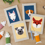 The four finished Terrier and Fox mini canvases laid out on a table