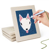 Hand punching one of the Terrier and Fox mini canvases