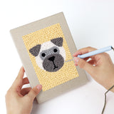 Punching a Terrier and Fox mini canvas with the punch needle