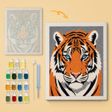 Tiger Face canvas before and after punching, with the threads and tools