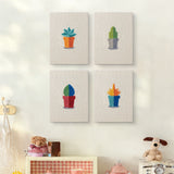 The four Tiny Cactus Garden mini canvases on a wall above a shelf