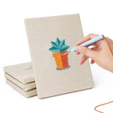 Hand punching one of the Tiny Cactus Garden mini canvases