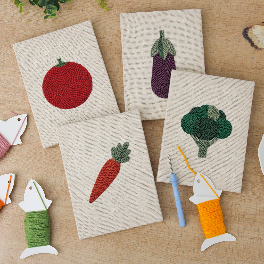 The four finished Tomato and Broccoli mini canvases laid out on a table