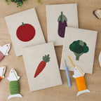 The four finished Tomato and Broccoli mini canvases laid out on a table