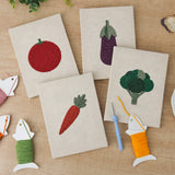 The four finished Tomato and Broccoli mini canvases laid out on a table