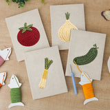 The four finished Tomato and Leek mini canvases laid out on a table