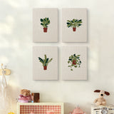 The four Trailing Ivy Pots mini canvases on a wall above a shelf