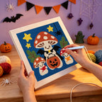 Punching the Trick-or-Treat Toadstools design with the punch needle