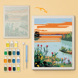 Tulip Lake Sunset canvas before and after punching, with the threads and tools