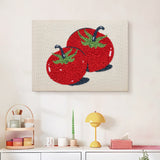 Finished Two Red Tomatoes punch needle canvas on a wall