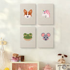 The four Unicorn and Frog mini canvases on a wall above a shelf