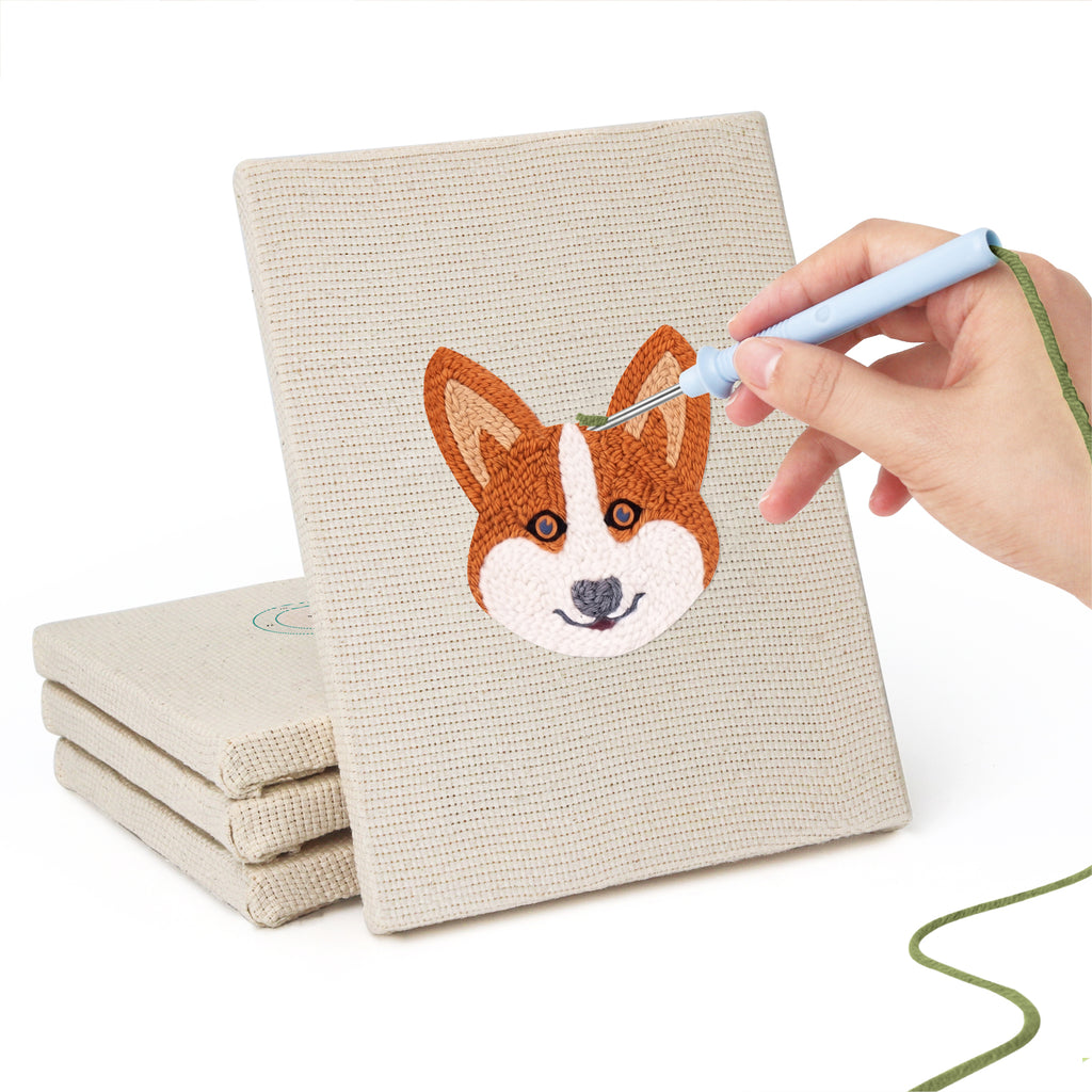 Hand punching one of the Unicorn and Frog mini canvases