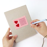 Punching a Valentine Notes mini canvas with the punch needle