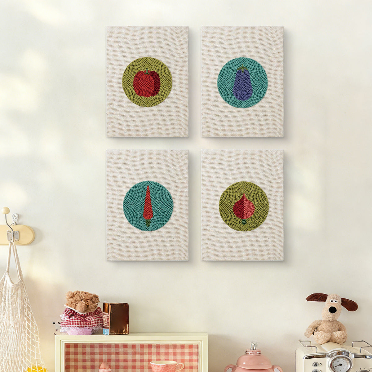 The four Veggie Circles mini canvases on a wall above a shelf