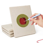 Hand punching one of the Veggie Circles mini canvases