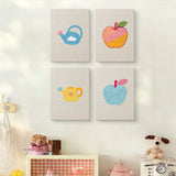 The four Watering Can Apples mini canvases on a wall above a shelf