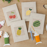 The four finished Watermelon and Lemon mini canvases laid out on a table