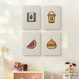The four Watermelon Lunch mini canvases on a wall above a shelf