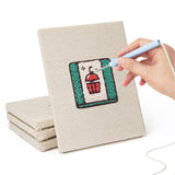 Hand punching one of the Watermelon Lunch mini canvases