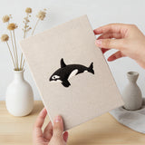 Hand holding a finished Whale and Orca mini canvas
