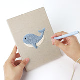 Punching a Whale and Orca mini canvas with the punch needle