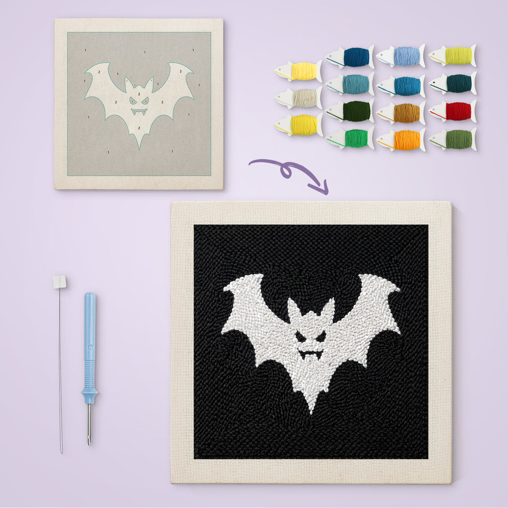 White Bat on Black canvas before and after punching, with the threads and tools