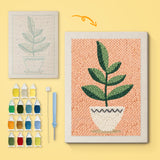 White Pot on Peach canvas before and after punching, with the threads and tools