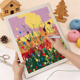 Punching the Wildflower Meadow design with the punch needle
