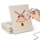 Hand punching one of the Windmill Village mini canvases