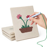 Hand punching one of the Windowsill Blooms mini canvases