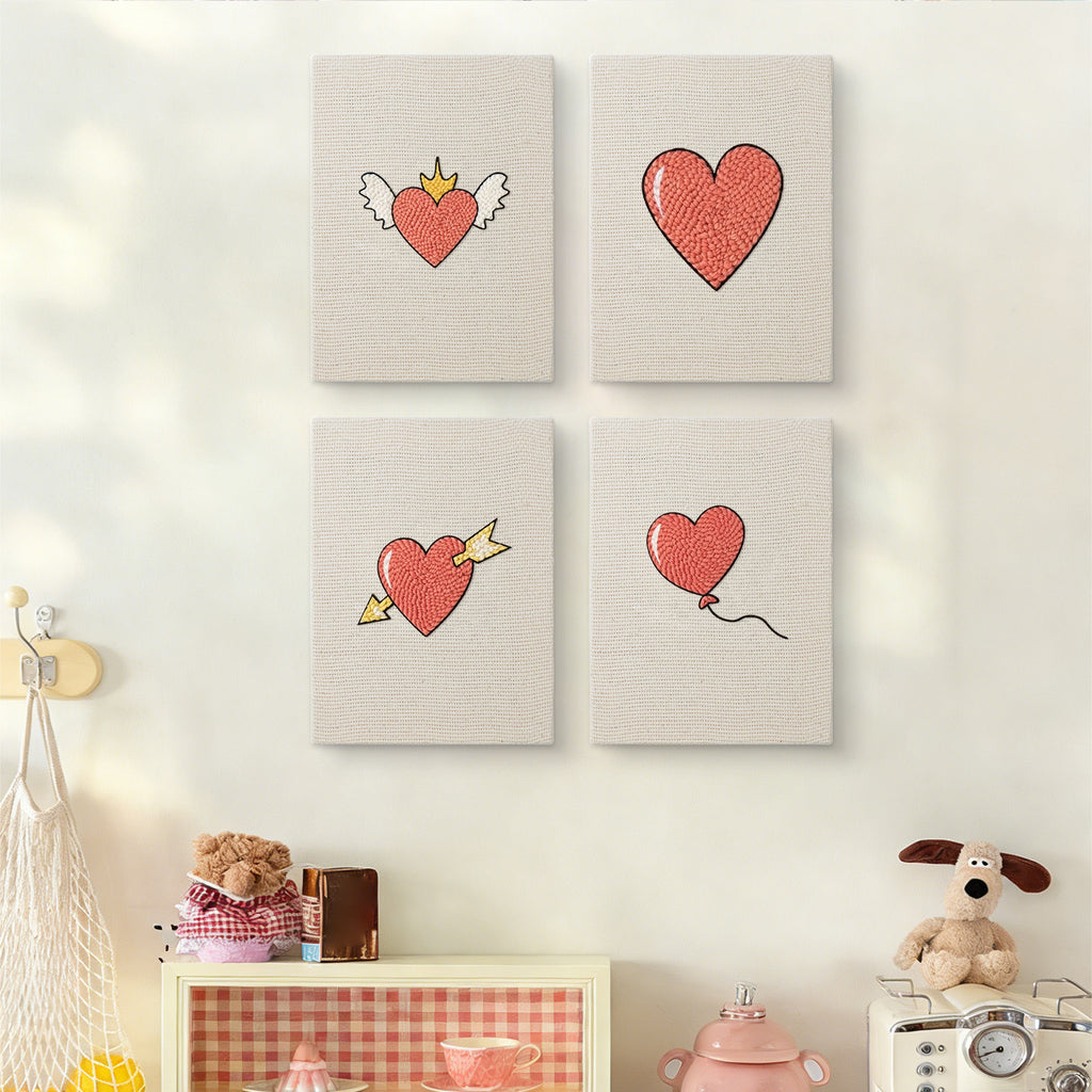 The four Winged Heart Mix mini canvases on a wall above a shelf