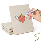 Hand punching one of the Winged Heart Mix mini canvases