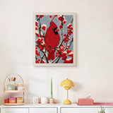 Finished Winter Cardinal punch needle canvas on a wall