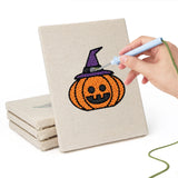Hand punching one of the Witch and Bunting mini canvases