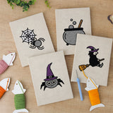 The four finished Witch and Cauldron mini canvases laid out on a table