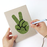 Punching a Witch and Spider mini canvas with the punch needle