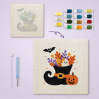 Witch Boot Bouquet canvas before and after punching, with the threads and tools