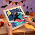 Punching the Witch Cat on a Wave design with the punch needle